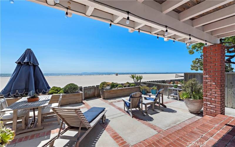 Large private patio leading to beach access.