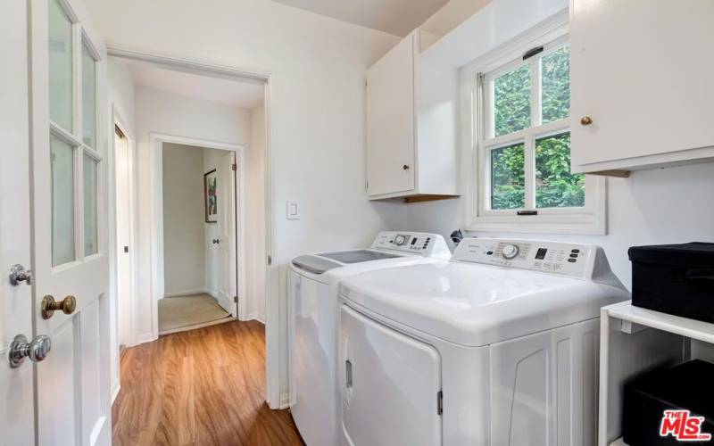 Laundry room with storage & side-by-side washer & dryer
