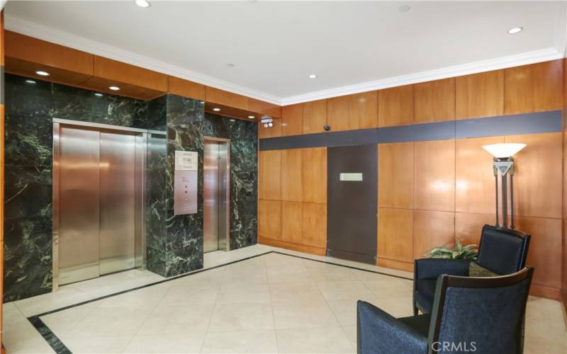 Spacious Elevator with seated bench in elevator