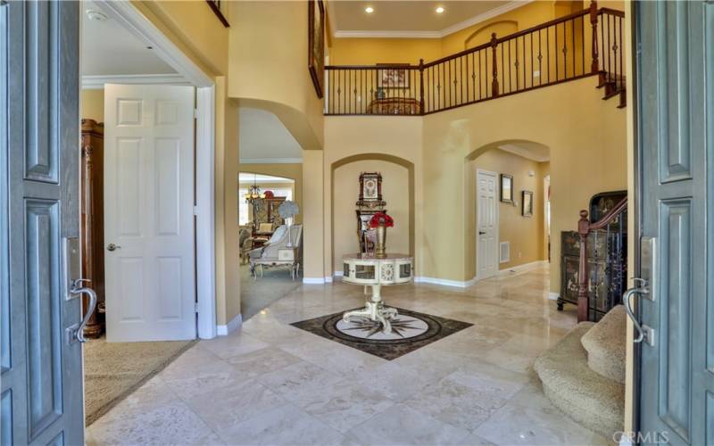 Very welcoming, high ceiling foyer leading to Study/office/ living room, family room and second floor.