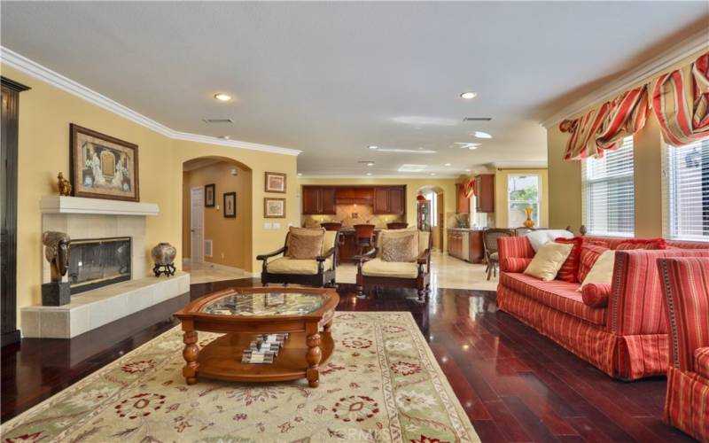 Very bright Family room featured with fire place, hard wood floors, crown molding.