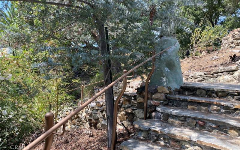 Stone stairway with copper handrails
