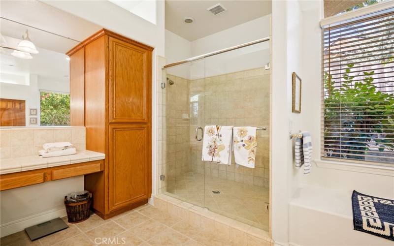 The ensuite bathroom has a large walk in shower with dual shower heads.
