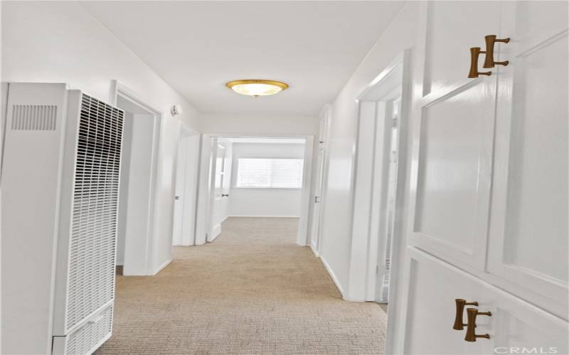 Center hallway offers built-in linen and coat closets.
