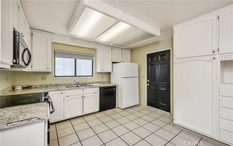 Kitchen with door coming in from garage.