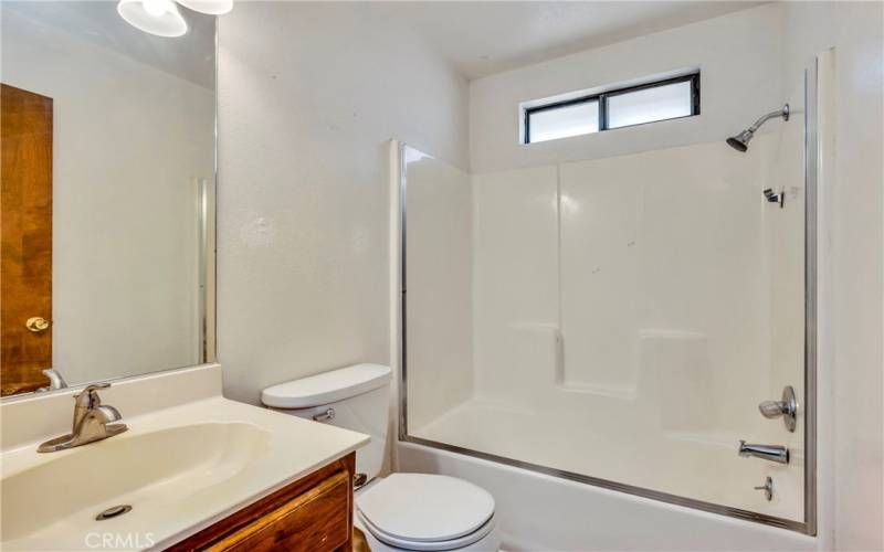 Upstairs hall bathroom with shower over tub.