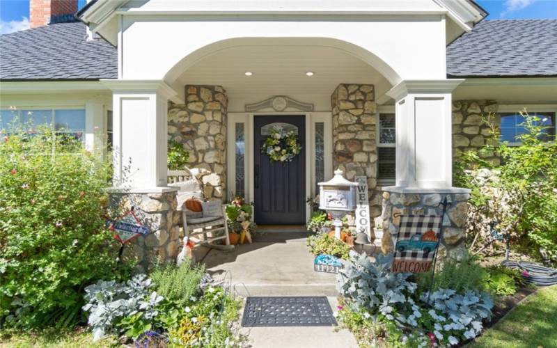 Relax and enjoy the beautiful front porch entry into your home.