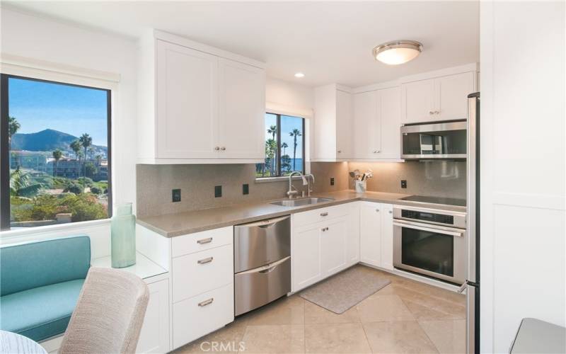 Kitchen with views of ocean, hills and coastline views!