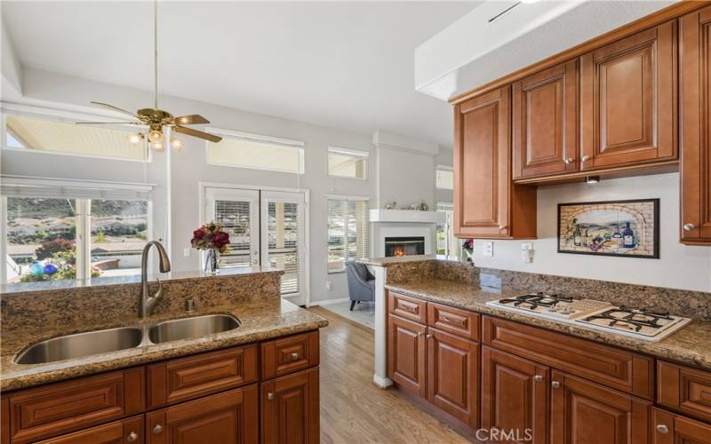 The kitchen also has views of the golf course and mountains. You can also visit with your guests in the family room.