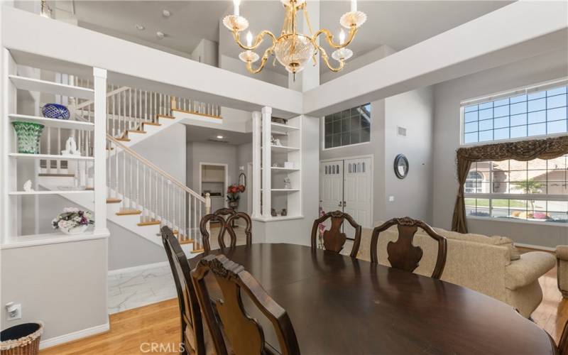 The dining room is defined by architectural accents. It is a spacious space with easy access to the kitchen.