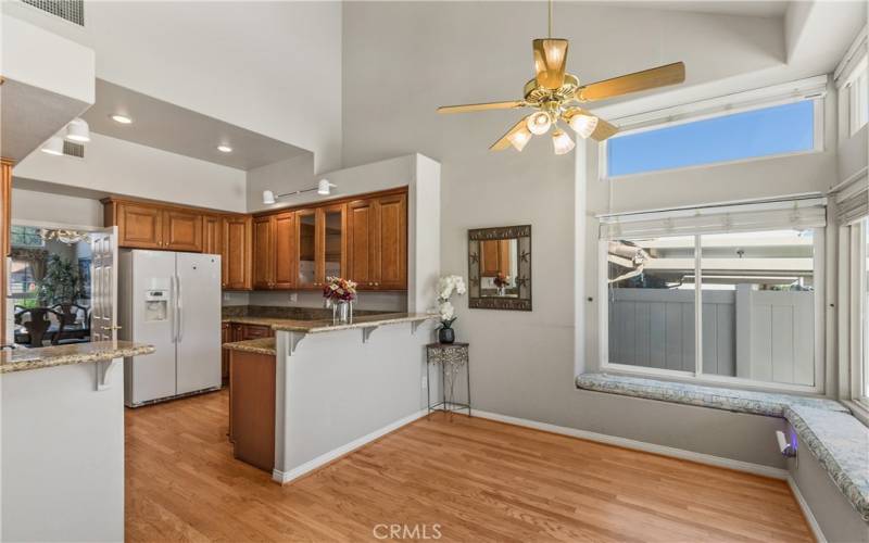 The kitchen opens to the kitchenette eating area as well as to the dining room.