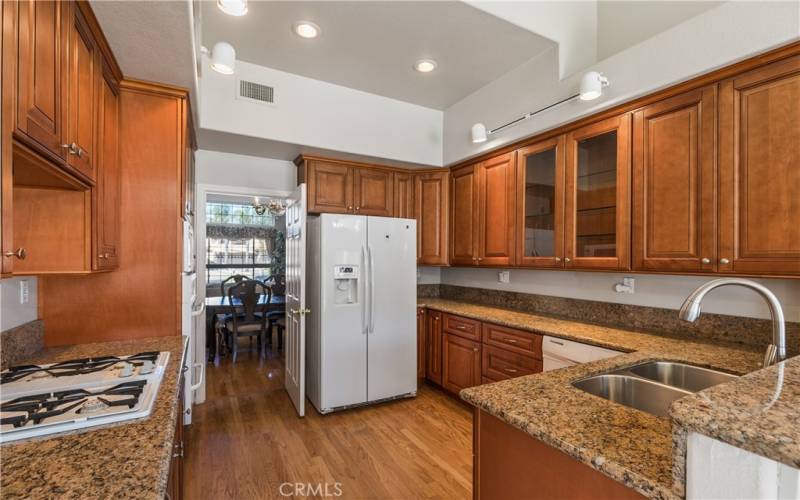 Kitchen upgrades include recessed lighting, custom cabinets with soft close hinges, and granite counters.