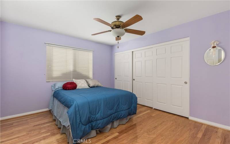 Upstairs, there is a guest bedroom which is a large room with oak floors matching the rest of the home.