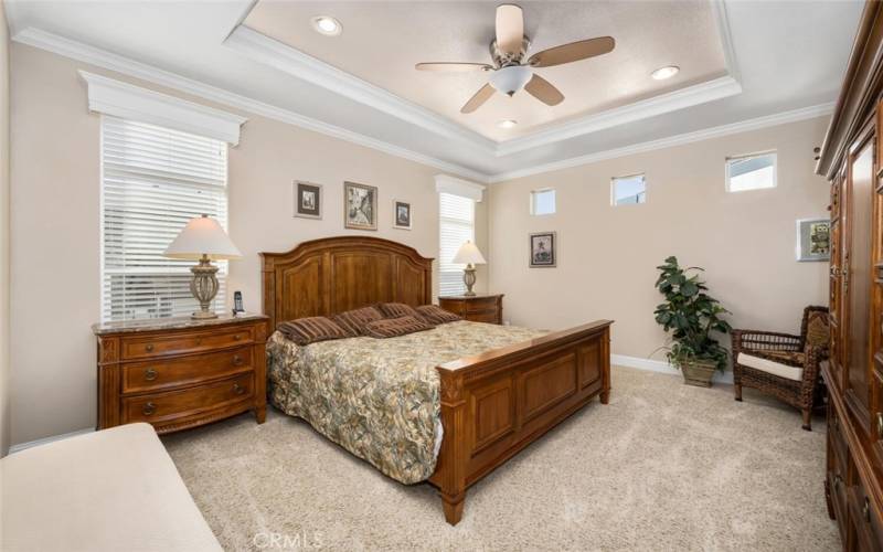Spacious Master Bedroom with many windows.