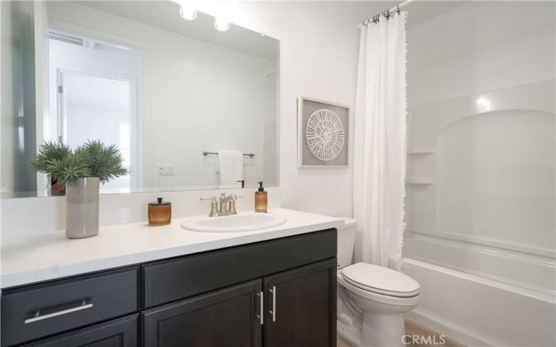 Guest Bath. Image depicts staged home of same floorplan. Actual home will vary.
