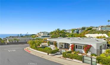Nestled in the prestigious Mystic Hills neighborhood of Laguna Beach, this 3,038 square foot custom home, mostly single level, boasts opulent amenities and abundant space for entertaining.