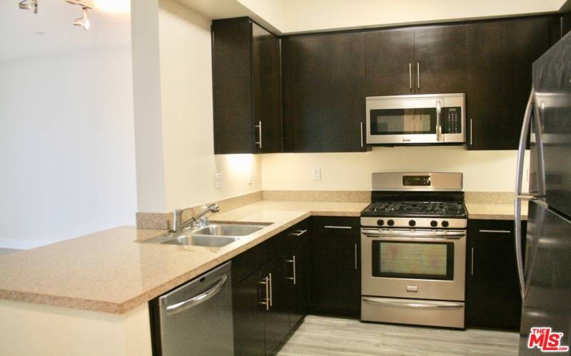 Open kitchen with in-unit washer/dryer!