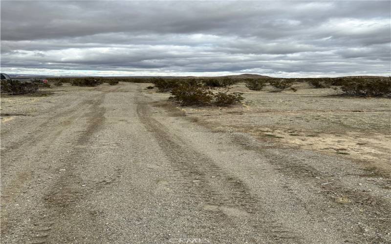 Road running  in front of parcel . Facing East