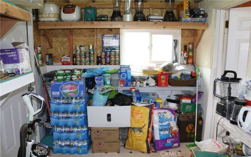 walk-in storage next to kitchen