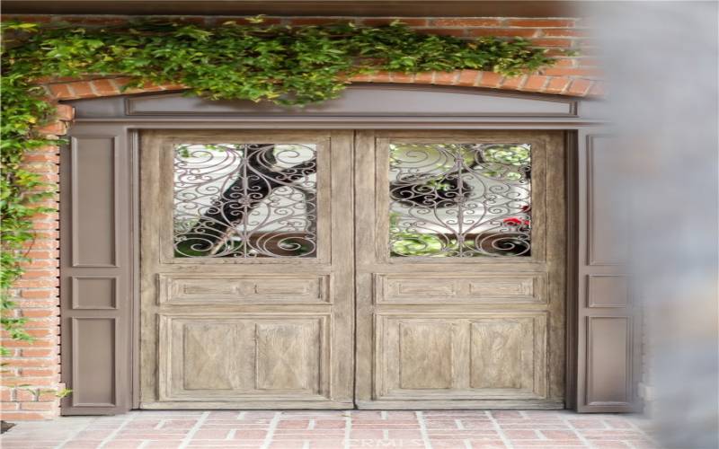 Reclaimed 200-year-old doors leading into front courtyard.