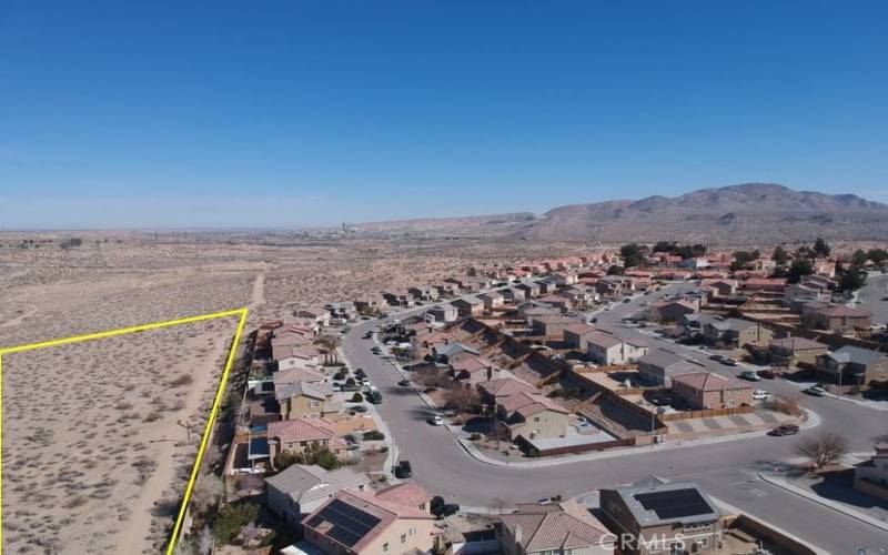 Drone shot of the nearby houses adjacent to the PIQ