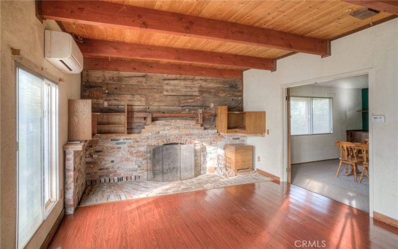 Raised floors, propane fireplace with natural stone hearth
