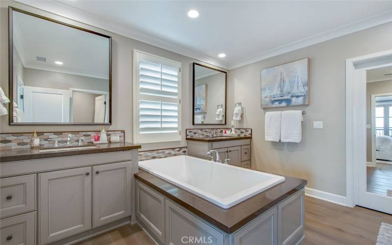 Bath in the Owners Suite with dual vanities and large soaking tub