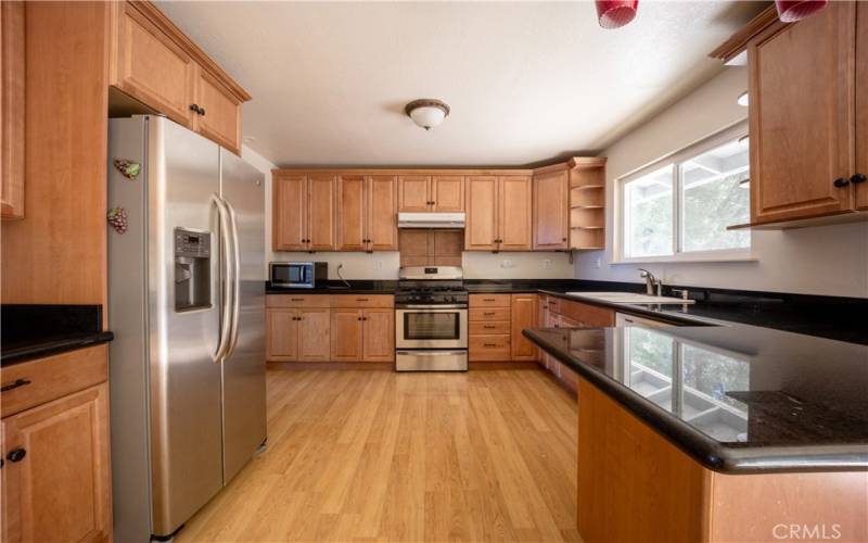 Stainless appliances. Granite counter tops and wood flooring.