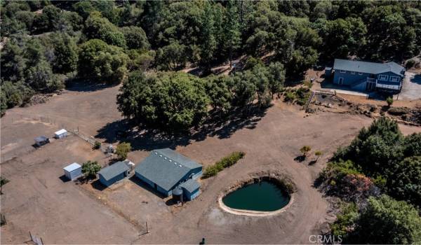 10 + usable fenced acres with a seasonal pond.