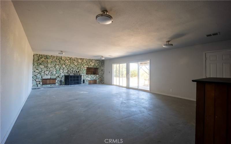 Large Rock fireplace and indoor barbeque