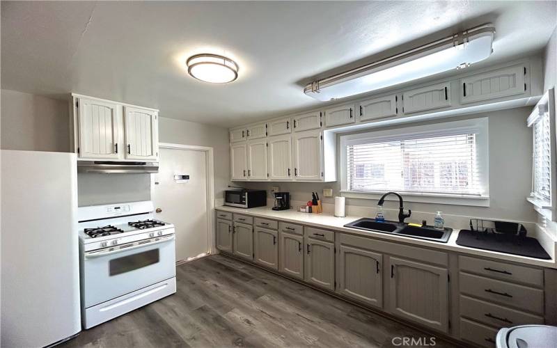 Front house kitchen with laundry room access