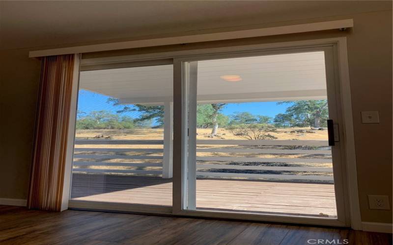 LIVING ROOM SLIDING DOOR TO THE COVERED DECK!