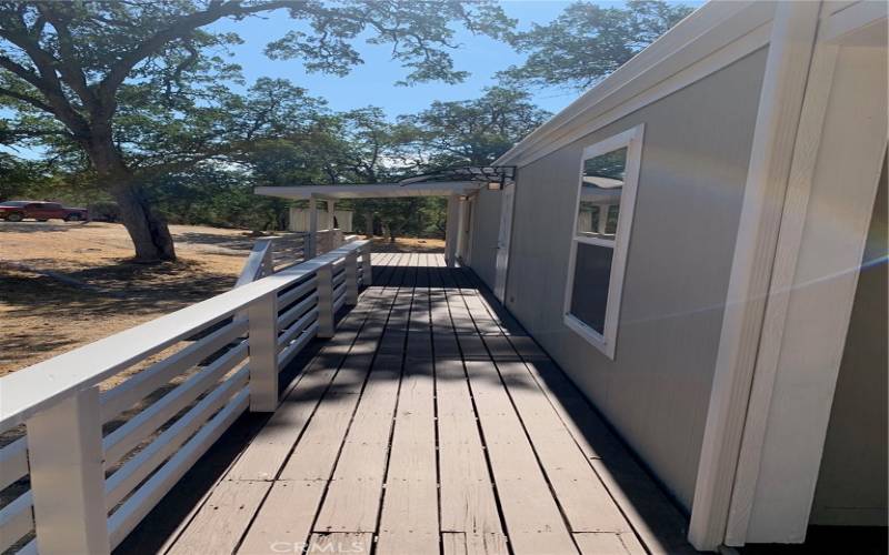 SWEET DECK ALONG NORTH SIDE OF THE HOME.