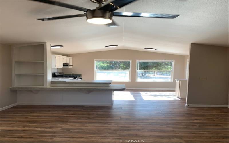 VIEW OF KITCHEN FROM THE LIVING ROOM.