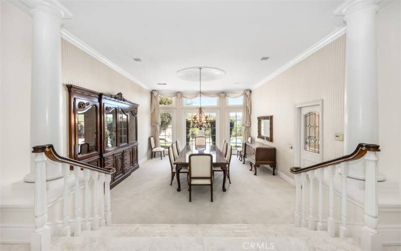 Formal Dining Room with chandelier, built-in China hutch and an abundance of natural light.