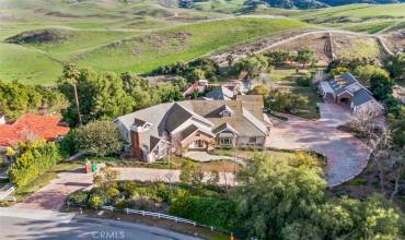 Sought-after Diamond Bar Hills Estate! This Two Parcel, 3.86 custom estate located in the prestigious, Country Estates is one of a kind.