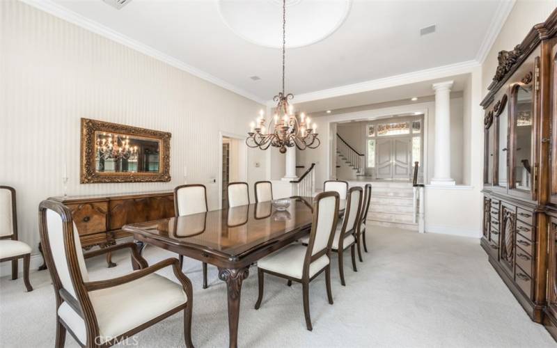 Formal Dining Room with chandelier, built-in China hutch and an abundance of natural light.