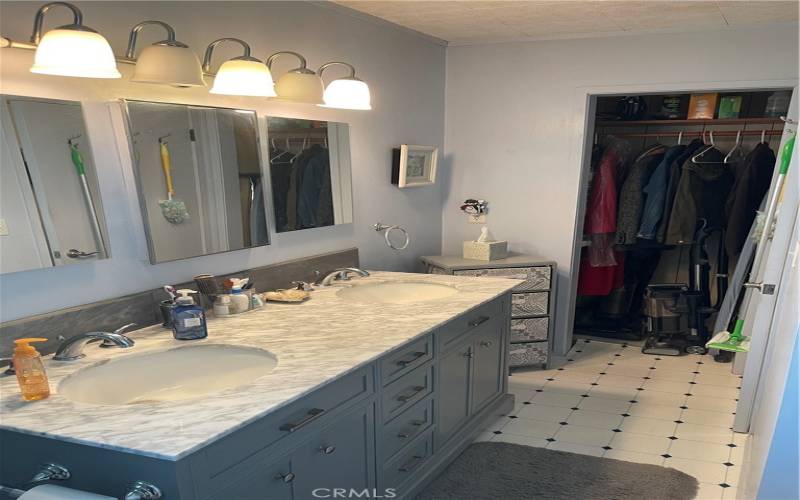 Two vanity sink and closet on interior master bathroom