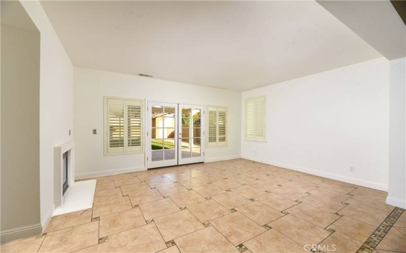 Family Room with elec. fireplace and doors to back yard