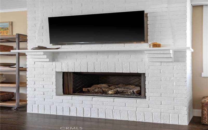 Custom designed brick fireplace in primary bedroom