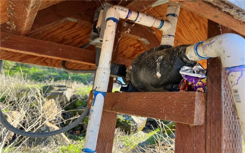 Water pump at the beach which pumps water from lake through a pipe that runs under the highway and upto the hill by home site.