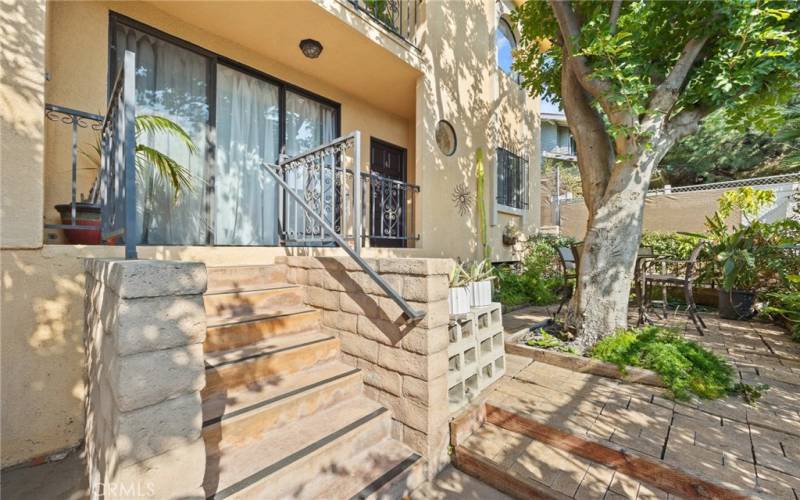 Step into your semi-private courtyard thru a locked gate. This is lovely garden area is shared with only 1 great neighbor to the left of your unit.