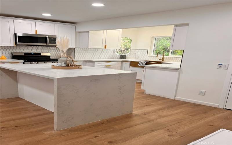 Kitchen Island - Quartz Countertop and waterfall on both sides of the island