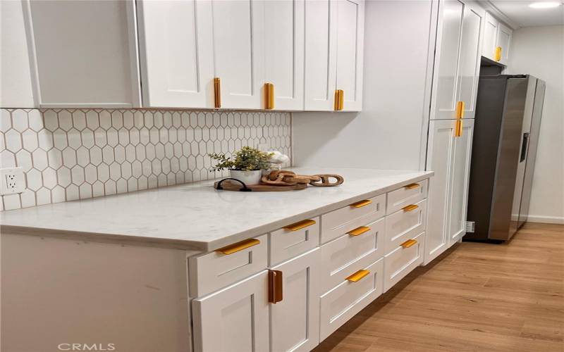 Kitchen Cabinets and Tile Backsplash - Stainless Steel appliances