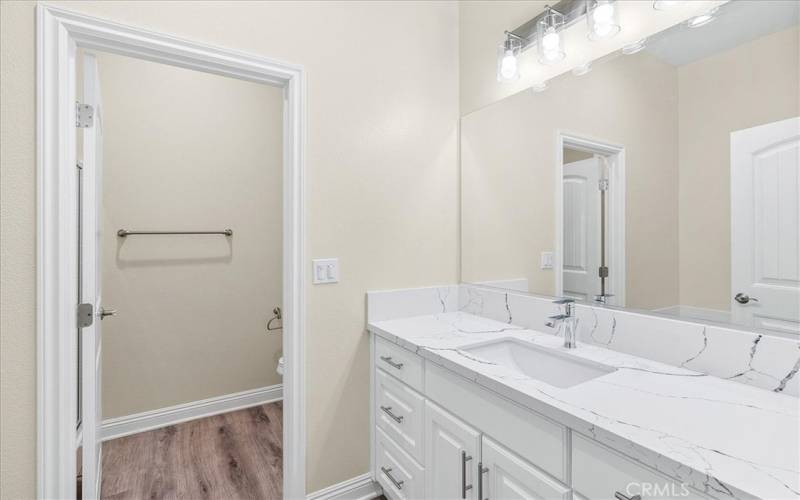 Bathroom with Quartz Counters.