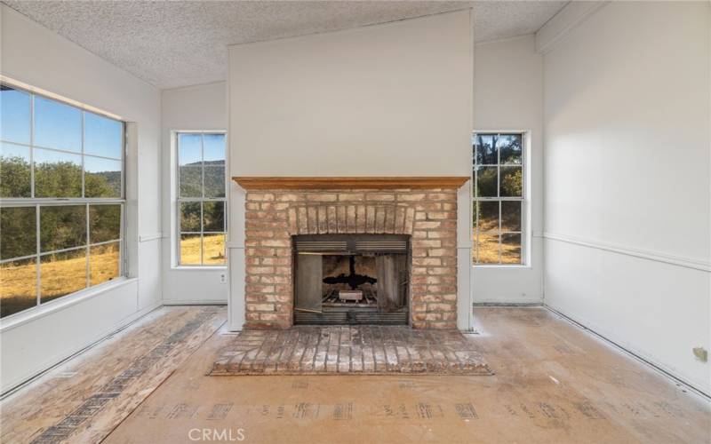 Fireplace. Photo taken prior to new carpet being installed!