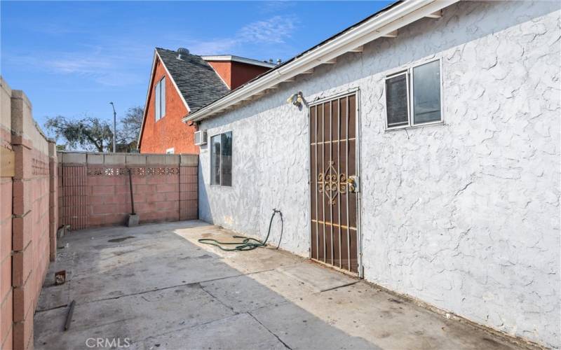 back unit entrance with patio area before entering back unit