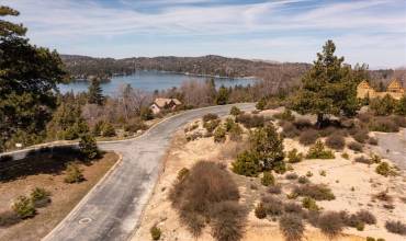 Easy buildable lot with a lake view. This is a drone photo of the lot building pad and the lakeview