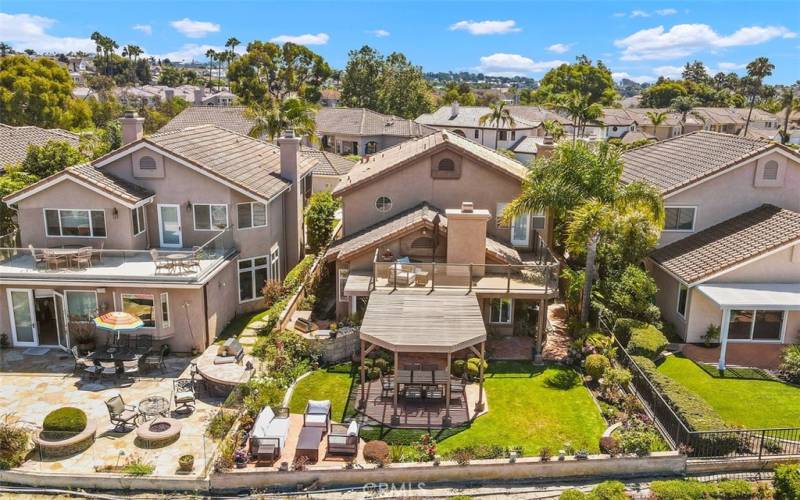 Aerial view of the backyard and home.