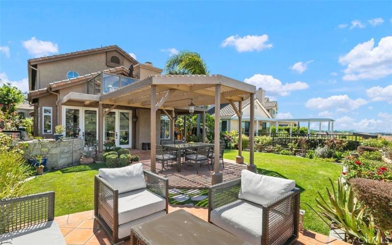 Large ocean and golf-course view yard.